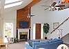 The stairs going upstairs to the MasterBed room and Master Bathroom- The Captain's Quarters!  The living room features a woodburning fireplace, 50" Plasma large screen TV with upgraded satelitte channels including the enhanced sports package.