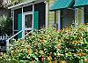 The side yard leads to the screened porch