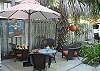 The back garden and patios also includes the Gas Grill. Notice the mermaid art on the fence!