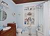 The master bathroom has a claw-foot bathtub (with shower and shower curtain). This bathroom is just off the master bedroom and full of wonderful bath salts and special details.