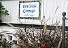 Our handpainted sign by a local artist features real seaglass all around the border!