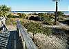 Stairs from deck leading out to beach.