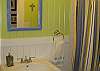 Bathroom features shower and tub- all in Seaglass colors!
