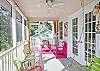 Bright, colorful screened porch awaits you at Barefoot Children!
