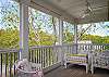 The sleeping porch is off the master bedroom on the 2nd floor. The porch is screened in and surrounded by large live oaks.
