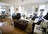 This is a view towards the front door (center) and the dining room to the left.  What a great room for playing games, catching up with family and friends, or just cozying up with a good book.