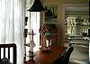 There is a desk in between the living room and the kitchen/ sun room.