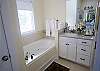 For the perfect relaxing bath, slide into this jetted-tub.  This bath is complete with a large shower stall, vanity and separate water closet.