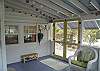 This is the front door from the steps in the front. They open up to the side screened porch and the cottage front door.