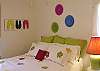 queen bedroom with half bath
how comfy!  Wall art is 3 pairs of funky flip-flops - Tybee art!