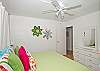 King bedroom.  Splashes of color and fun wall hangings make this room a favorite!