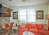 This area is a combination living space- family room with large flat screen TV, lots of seating, small step up to dining room area and leads to the kitchen as well.