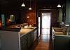 The kitchen is a galley kitchen and fully stocked with everything you need for any type of meals.  We are a true cottage kitchen so we do not have a dishwasher, but everything else you need is there! We also include a basic coffee service for our guests.