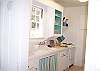 The kitchen is a true cottage kitchen. Open shelves (for easy access) fully stocked and equipped (except there is not a dishwasher). Everything you need to cook three meals a day!  However you are on vacation - pack a picnic lunch and head to the beach!
