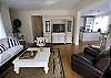 Upon entering the front door, you walk into the living room area.  All the furnishings are from Paula's new line of furniture and rugs. There is ample seating, a queen-size sofa bed, and an entertainment center with a flat screen TV.  To the right, you see into the dining room and kitchen.