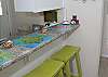 The three stools allow you to sit at the kitchen bar and watch the chefs cookin'!