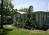 The back of Tybee Tides, this is the outside private hot and cold water shower and the enterance from the back.
