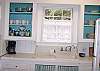 A classic bright white cottage kitchen with open shelving and eyelete curtains! Also provided is our wonderful "Mermaid Morning Bliss" coffee - you will want to head to Seaside Sisters and pick some up to take home! All proceeds go to our Sea Turtle project - saving endangered species!