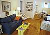 Living Room which has a TV, Stereo and CD player flows into the dining room area. These are the original Heart of Pine floors completely restored.