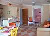 The main living part of the cottage included the living area, the dining area with table and 4 chairs, the counter with two bar stools and full kitchen.
