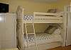 The Bunk Room features 1 set of bunk beds with a twin trundle below, sleeps 3. Great space for kids! This bedroom, like all the bedrooms features a flat screen TV and DVD player.
