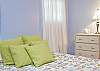 This bedroom is so calming and relaxing.  The pae blue walls and the twin bed make this ideal for a young family or an extra bed to relax and read.
