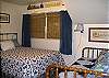 A Queen bed and a twin make this room perfect for a couple with small children or for  a night of giggling teenagers!
