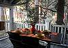 The screened porch has a partial marsh view, seating for 6 people. Great to eat, relax and entertain