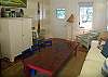 The living room features an old elementary school table cut down to form the coffee table. We even have 3 old school chairs for seating. There is cable TV in this room as well.