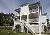 This home sits on the corner of Miller Ave and 2nd Street. A short 4 block walk to the beach.  The home has porches and decks on all levels.