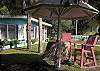 The front yard complete with the tiki hut. Photo courtsey of Margie Greer. www.margiegreer.com