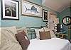The queen bedroom is on the 2nd floor and has cable TV. The master bathroom on the 2nd floor is also off this bedroom.  The bedroom has one queen bed and one twin bed.