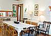 The dining area features a farm style table with seating for 8. There is also two stools which sit at the counter. There is also a kitchen table and 6 chairs in the kitchen. Lots of seating for lots of family and friends meals!