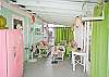 Our screened porch continues to get better and better. Lime green outdoor curtains, lots of seating- even "Phil" a vintage pink refrigerator from the 1950's Mary Kay restored. Ready to hold all those beachy themed beverages!