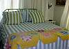 "Katie's Room" features 1 Queen bed. Beautiful handmade vintage quilts, floor to ceiling linen curtains .