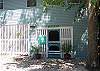The entrance goes thru the screened porch into the home.