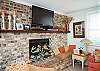 This area is a combination living space- family room with large flat screen TV, lots of seating, small step up to dining room area and leads to the kitchen as well.
