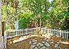 The back yard features a patio, charcoal grill, outdoor shower with hot and cold water, clothes line and even view of the salt marsh. Great for bird watching!