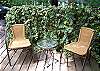 The back deck has a grill and seating to over look the back yard and partial marsh view. The outdoor shower connected by the walkway