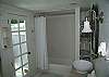 Master Bathroom.  The door leads to the outdoor private shower with hot and cold water.