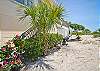 View from stairs out to beach. Large deck on beach side of house for great views!
