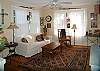 The living room has great seating and a tv. Lots of natural light!