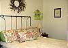 Comfy Queen bed awaits you after a long day of fun and sun at the beach!