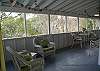 The porch has lots of wicker seating to relax, read and just enjoy Tybee.