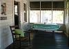 The front screened porch includes a picnic table to seat 6 as well as other seating. An ideal spot to people watch- especially during one of Tybee's parades!