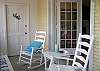 Plenty of rocking chairs for the front screened porch!  Perfect for people watching the beach strollers or bicyclist or enjoying the peacefulness of the quiet street.