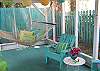 Views of the screened porch on rear of cottage.  Fun, bright and colorful!