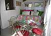 Another view of the wonderful Sunroom and also bedroom. Wouldn't you love to sleep here waking up to the garden views from the windows? The day bed is a twin bed with a twin trundle