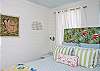 This bedroom is also upstairs and features vintage "bark cloth" fabric for the headboard.