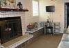 Family room with with non-working fireplace - the owner has a lovely pot with lights and shells for ambiance!  sit back and read a book here!  Also a desk if you actually have to work - but why?  You are on Tybee Time!  Free wi-fi!